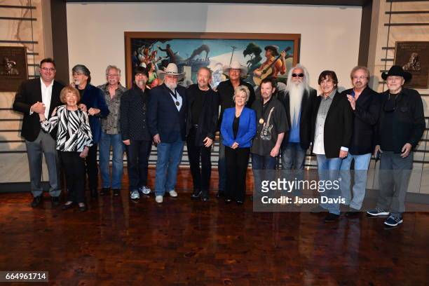 Country Music Hall of Fame Inductees Songwriter Don Schlitz and Recording Artist Alan Jackson pose along with existing Hall of Fame members during...