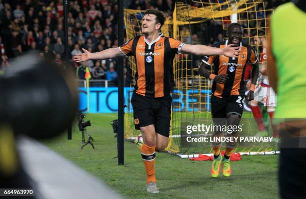 Hull City's English defender Harry Maguire celebrates scoring his team's fourth goal during the English Premier League football match between Hull...