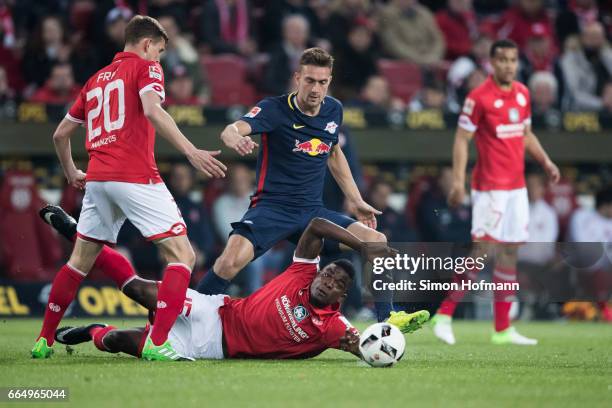 Jhon Cordoba of Mainz is challenged by Stefan Ilsanker of Leipzig during the Bundesliga match between 1. FSV Mainz 05 and RB Leipzig at Opel Arena on...