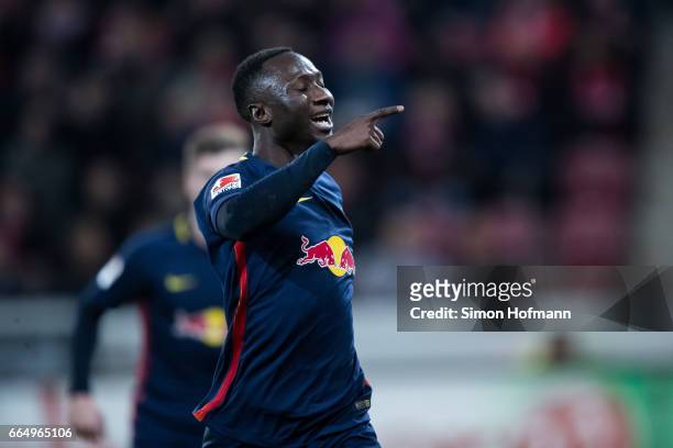 Naby Keita of Leipzig celebrates his team's third goal during the Bundesliga match between 1. FSV Mainz 05 and RB Leipzig at Opel Arena on April 5,...