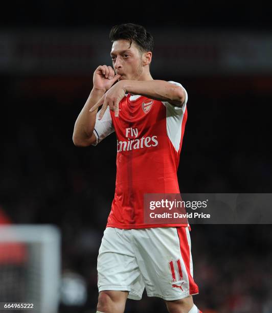 Arsenal's Mesut Ozil celebrates scoring a goal for Arsenal during the Premier League match between Arsenal and West Ham United at Emirates Stadium on...