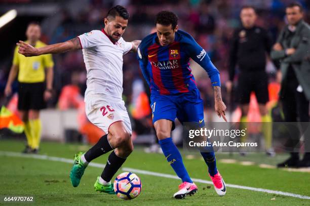 Victor Machin 'Vitolo' of Sevilla FC fouls Neymar Santos Jr of FC Barcelona during the La Liga match between FC Barcelona and Sevilla FC at Camp Nou...
