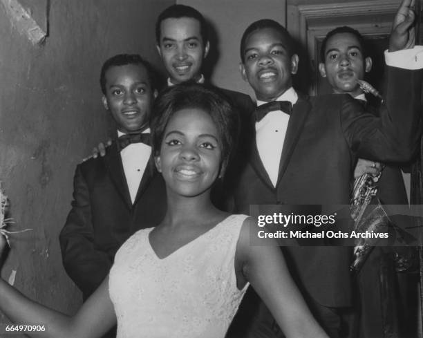 Group Gladys Knight and the Pips pose backstage at the Apollo Theatre circa 1964 in New York City, New York.
