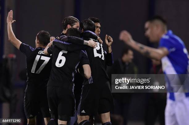 Real Madrid players celebrate after scoring their fourth goal during the Spanish league football match Club Deportivo Leganes SAD vs Real Madrid CF...