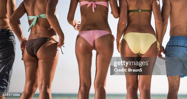 panoramic view of unrecognizable people in swimwear during summer day. - beach bum stock pictures, royalty-free photos & images