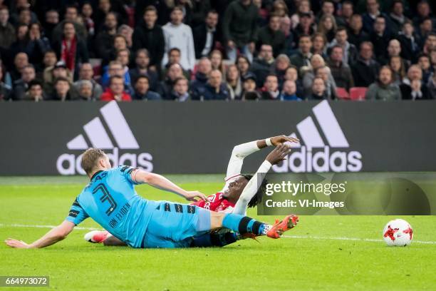 Rens van Eijden of AZ, Bertrand Traore of Ajaxduring the Dutch Eredivisie match between Ajax Amsterdam and AZ Alkmaar at the Amsterdam Arena on April...