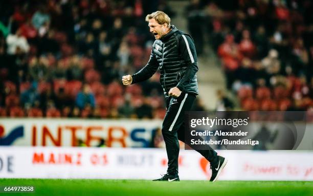 Head coach Ralph Hasenhuettl of Leipzig celebrates the first goal for his team during the Bundesliga match between 1. FSV Mainz 05 and RB Leipzig at...