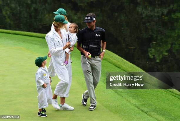 Bubba Watson of the United States, his wife Angie, daughter Dakota and son Caleb walk during the Par 3 Contest prior to the start of the 2017 Masters...