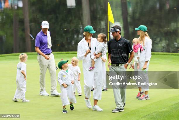 Bubba Watson of the United States, his wife Angie, daughter Dakota and son Caleb walk during the Par 3 Contest prior to the start of the 2017 Masters...