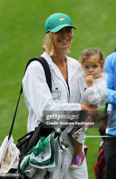 Wife Angie and daughter Dakota of Bubba Watson of the United States walk during the Par 3 Contest prior to the start of the 2017 Masters Tournament...