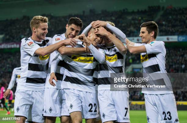 Laszlo Benes of Borussia Moenchengladbach celebrate with his teammates after he scores his teams first goal during the Bundesliga Match between...