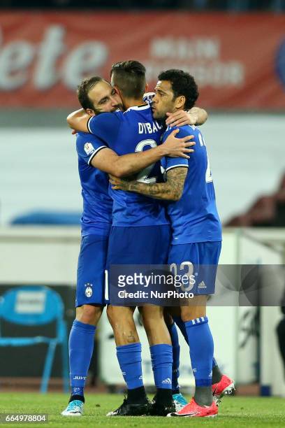 Gonzalo Higuain of Juventus celebrating with Paulo Dybala and Daniel Alves of Juventus during the TIM Cup match between SSC Napoli and Juventus FC at...