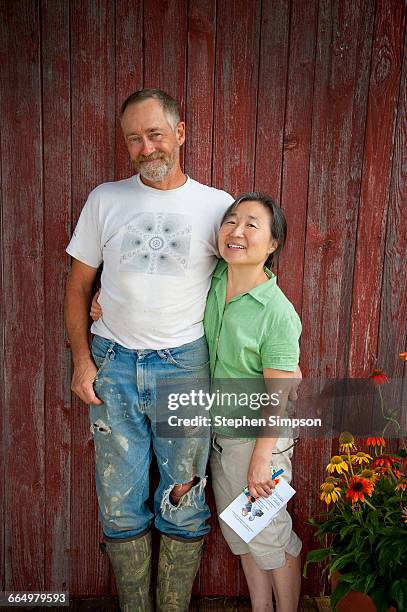 informal rural couple portrait with muddy boots - ithaca new york stock pictures, royalty-free photos & images