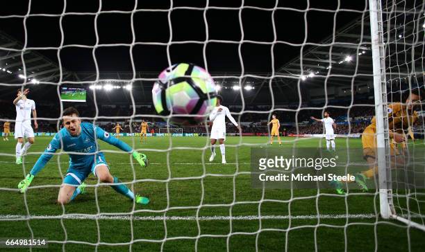 Dele Alli of Tottenham Hotspur scores his sides first goal during the Premier League match between Swansea City and Tottenham Hotspur at the Liberty...