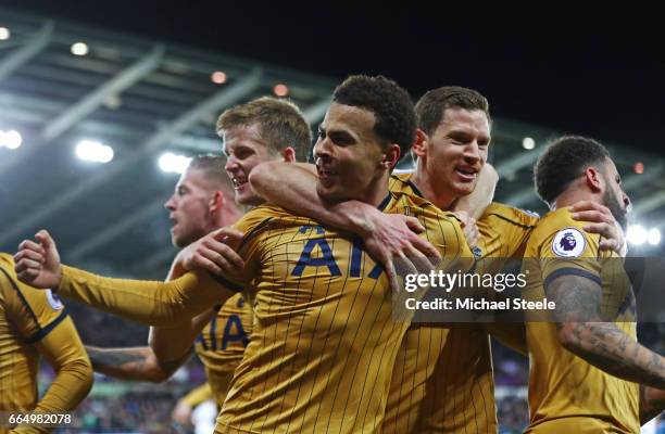 Dele Alli of Tottenham Hotspur celebrates scoring his sides first goal with his Tottenham Hotspur team mates during the Premier League match between...