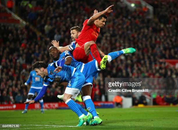 Benik Afobe of AFC Bournemouth and Dejan Lovren of Liverpool battle to win a header during the Premier League match between Liverpool and AFC...