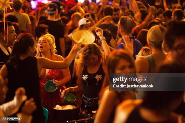 dancing female tourists in crowd in khao san road - khao san road stock pictures, royalty-free photos & images