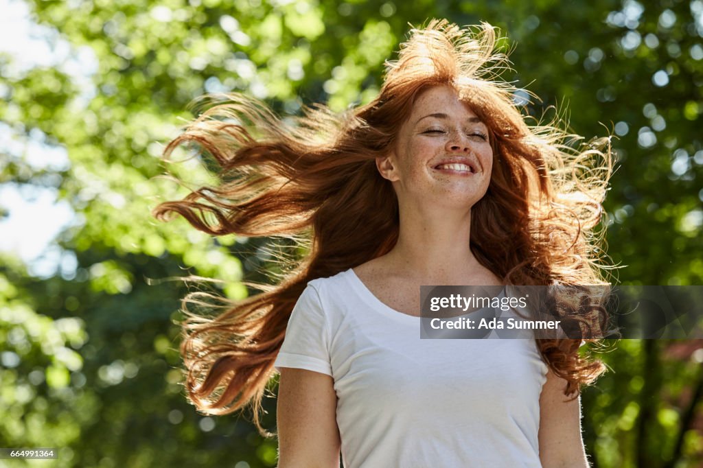 Redhead enjoying the first rays of sun