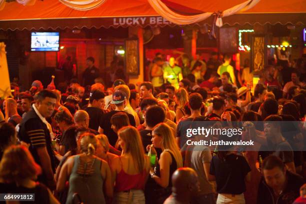 dancing and party scene in khao san road - crowded bar stock pictures, royalty-free photos & images
