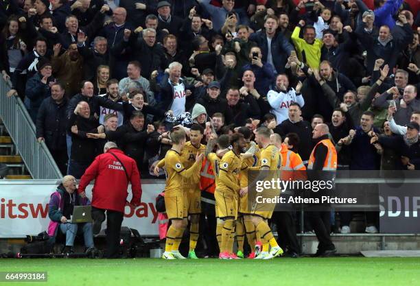 Tottenham Hotspur players celebrate their win during the Premier League match between Swansea City and Tottenham Hotspur at The Liberty Stadium on...