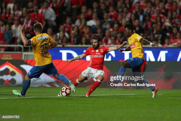 April 05: Benfica's midfielder Rafa Silva from Portugal tries to shoot to goal between Estoril's midfielder Diogo Amado from Portugal and Estoril's...