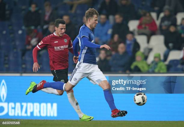 Edgar Prib of Hannover and Tjorben Uphoff of Schalke battle for the ball during the friendly match between Hannover 96 an FC Schalke 04 at HDI-Arena...