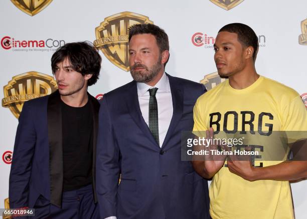 Actors Ezra Miller, Ben Affleck and Ray Fisher attend the Warner Bros. Pictures presentation during CinemaCon at The Colosseum at Caesars Palace on...