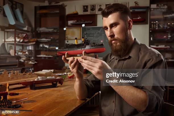 young man constructing a ship model - model kit stock pictures, royalty-free photos & images
