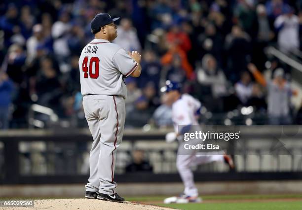 Bartolo Colon of the Atlanta Braves reacts as Jay Bruce of the New York Mets rounds the bases after a solo home run in the fifth inning on April 5,...