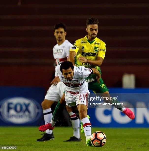 Wellington Nem of Sao Paulo fights for the ball during a first leg match between Defensa y Justicia and Sao Paulo as part of of first round of Copa...