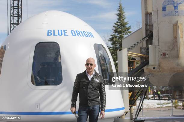 Jeff Bezos, chief executive officer of Amazon.com Inc. And founder of Blue Origin LLC, speaks at the unveiling of the Blue Origin New Shepard system...