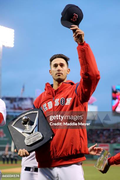 Rick Porcello of the Boston Red Sox acknowledges fans after receiving his Cy Young award before the game against the Pittsburgh Pirates at Fenway...