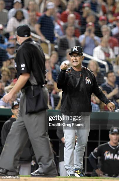 Manager Don Mattingly of the Miami Marlins argues with umpire Ron Kulpa after being ejected from the game in the seventh inning against the...