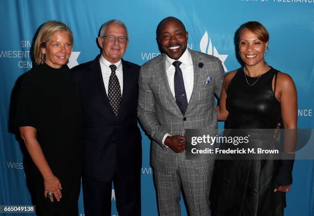 Kelly Burke, NBCUniversal Vice Chairman Ron Meyer, Producer Will Packer and Heather Packer attend The Simon Wiesenthal Center's 2017 National Tribute...