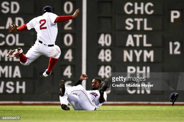 11th Jackie Bradley Jr. #19 of the Boston Red Sox slides beneath Xander Bogaerts to catch a fly ball hit by Gregory Polanco of the Pittsburgh Pirates...
