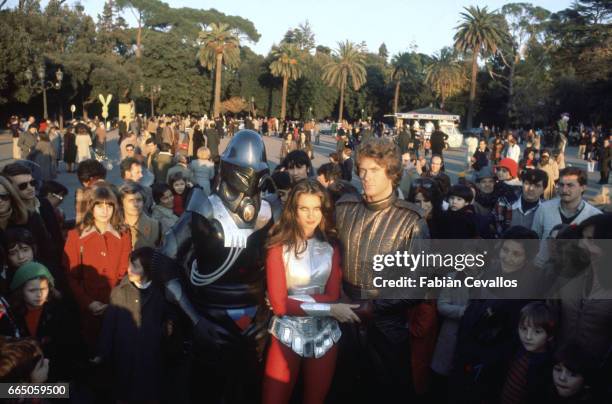 Hamilton Camp , Caroline Munro, and David Hasselhoff stand among a crowd of fans in Rome. The three appear in science fiction movie Starcrash, by...