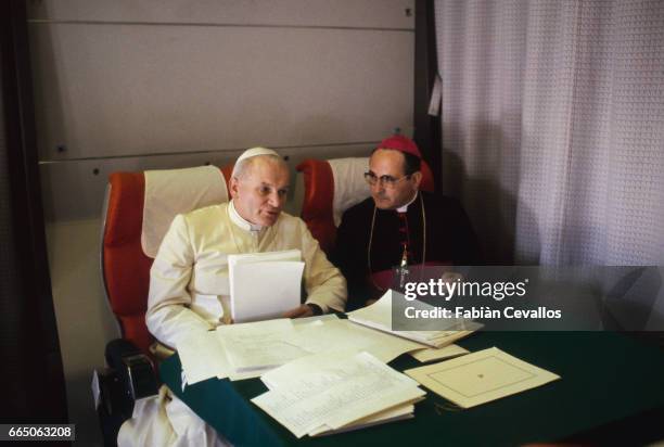 Pope John Paul II, accompanied by Cardinal Poletti, in the plane on the way to South America, for his first apostolic trip to this region.