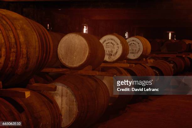 Whiskey ageing in barrels. Old Bushmills Distillery, the world's oldest licensed distillery in County Antrim uses spring water from Saint Columb's...