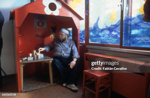 Director Marco Ferreri sits in one of the sets from his 1979 film, Chiedo Asilo. The Italian film, known in French as Pipicacadodo and in English as...