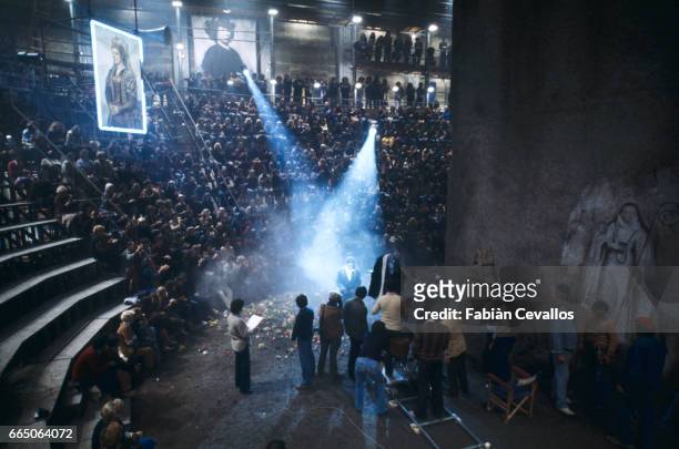 Aerial view of Federico Fellini directing Marcello Mastroianni as film extras and crew members look on during the filming of La Citta delle Donne,...