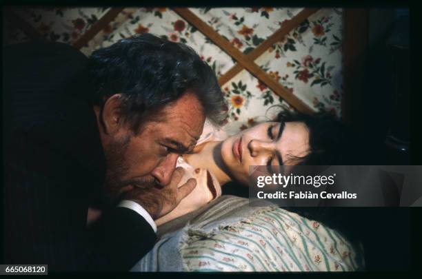 Italian actors Laura Morante and Ugo Tognazzi lay on a bed together, on the set of Italian director Bernardo Bertolucci's movie Tragedy of a...