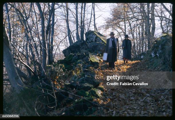 French actress Anouk Aimee and Italian actor Ugo Tognazzi walk on a country path, on the set of italian director Bernardo Bertolucci's movie Tragedy...