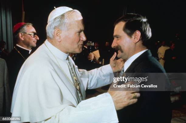 Pope John Paul II welcomes the head of the Polish syndicate, Solidarnosc, Lech Walesa.
