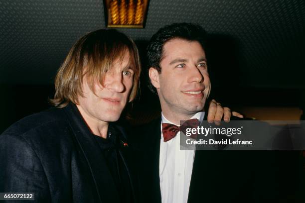 French actor Gerard Depardieu and American actor John Travolta attend the premiere of the movie Cyrano de Bergerac, based on the play by Edmond...