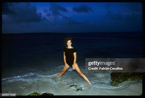 Marlene Jobert stands in the surf while on vacation in Mauritius.
