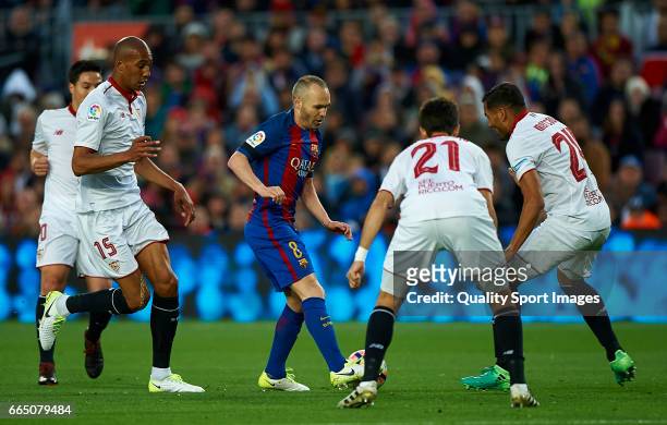Andres Iniesta of Barcelona surrounded by players of Sevilla during the La Liga match between FC Barcelona and Sevilla FC at Camp Nou Stadium on...