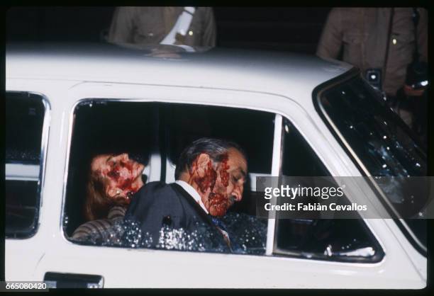 In a scene from the movie "Cento Giorni a Palermo", directed by Giuseppe Ferrara, actors Lino Ventura and Giuliana De Sio sit dead in the car where...