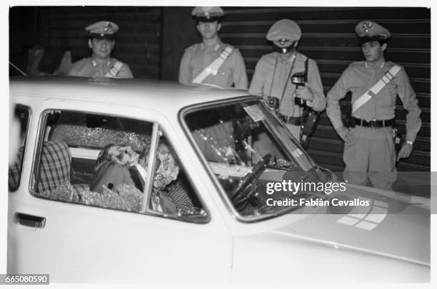 In a scene from the movie "Cento Giorni a Palermo", directed by Giuseppe Ferrara, actors Lino Ventura and Giuliana De Sio sit dead in the car where...