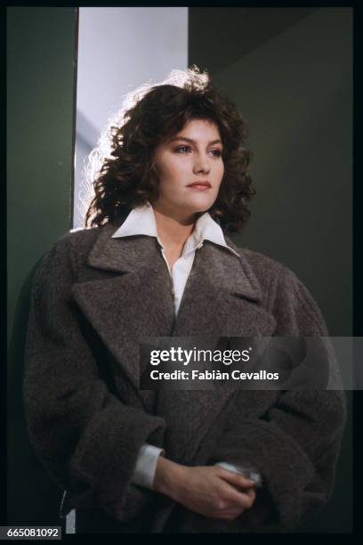 In a scene from the movie "Lui e peggio di me", directed by Enrico Oldoini, actress Kelly Van der Velden poses for a portrait with a brown coat on....