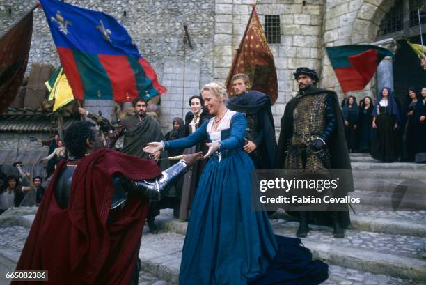 Spanish opera singer, Placido Domingo greets Katia Ricciarelli in the role of Desdemona, as Justino Diaz looks on, in Italian director Franco...